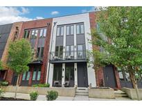 Charming townhome featuring brick accents, a balcony, and modern design elements for stylish urban living at 1251 Chelsea Nw Cir # 30, Atlanta, GA 30318