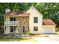 Charming two-story home with stone accents and a welcoming front porch and one car garage at 2568 Redfield Dr, Norcross, GA 30071