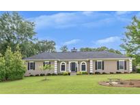Charming single-story home featuring a well-manicured lawn and inviting curb appeal at 2265 Colony Dr, Canton, GA 30114