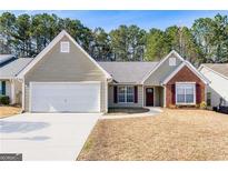 Charming single-Gathering home with a well-manicured front yard and attached two-car garage at 2350 Laurel Pointe Ln, Lawrenceville, GA 30043