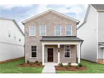 Charming two-story home featuring a classic brick facade and a welcoming front porch at 3021 Cambridge Mill St, Acworth, GA 30102