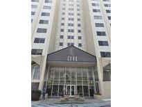 Exterior shot of the Park Lane 2479 building entrance with its glass doors and covered entryway at 2479 Peachtree Ne Rd # 902, Atlanta, GA 30305