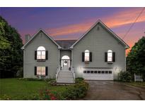 Charming two-story home featuring traditional architecture, manicured lawn, and inviting front entrance with stairway at 270 Meadow View Dr, Grayson, GA 30017