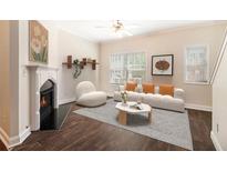 Bright living room featuring a fireplace, recessed lighting, and plenty of natural light at 3068 Lauren Parc Rd, Decatur, GA 30032