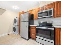 Efficient kitchen with stainless steel appliances and convenient in-unit laundry at 2355 Henderson Mill Ne Rd # 6, Atlanta, GA 30345