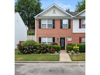 Charming brick townhome with a well-maintained front yard and a welcoming entrance at 1955 Shawn Wayne Se Cir, Atlanta, GA 30316