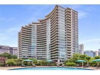 Upscale condominium building with an outdoor pool and lounge area at 700 Park Regency Ne Pl # 703, Atlanta, GA 30326
