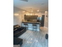 Modern kitchen featuring stainless steel appliances, granite countertops, and a breakfast bar at 870 Mayson Turner Nw Rd # 1102, Atlanta, GA 30314