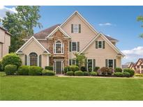 Attractive home with well-manicured lawn and stone accents at 3743 Lake Edge Dr, Suwanee, GA 30024