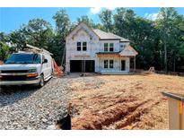 New home construction with white exterior and work van in the driveway at 731 Crest Line Trl, Powder Springs, GA 30127
