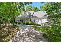 Beautiful home with a large front yard and inviting front porch at 2058 Sewanee Ct, Villa Rica, GA 30180