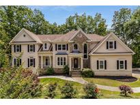 Charming two-story home with manicured lawn and lush landscaping at 912 Chipley Ct, Marietta, GA 30062
