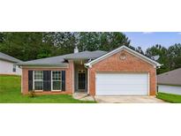 Charming one-story brick home with a well-manicured lawn and an attached two-car garage at 10247 Deep Creek Pl, Union City, GA 30291