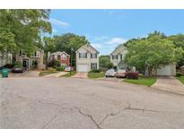 Charming suburban homes with well-maintained lawns and tree-lined street showcasing a peaceful residential neighborhood at 3984 Oak Glenn Dr, Duluth, GA 30096