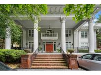 Stately home featuring large columns and an inviting brick staircase with wrought iron railings at 893 Piedmont Ne Ave # 3, Atlanta, GA 30309