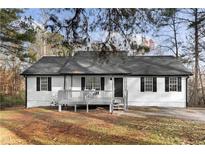 Charming ranch home featuring a covered porch and neatly maintained landscaping at 247 Mandy Ct, Mcdonough, GA 30252