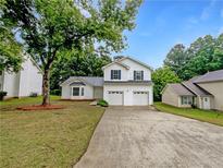 Charming two-story home with a two-car garage and a well-maintained front yard at 2397 Charleston Ter, Decatur, GA 30034
