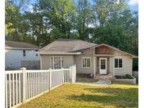 Charming single-story home with a well-manicured lawn and a white picket fence, offering curb appeal at 1684 Braeburn Se Dr, Atlanta, GA 30316