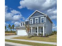 Charming two-story home featuring a welcoming porch and a two-car garage at 515 Regency Trl, Acworth, GA 30102
