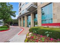 The Manhattan features a beautiful brick and stone facade with manicured landscaping at its entrance at 4561 Olde Perimeter Way # 806, Dunwoody, GA 30346