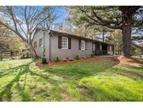 Charming single-story home with a well-manicured lawn and inviting curb appeal at 2760 Swansea Ct, College Park, GA 30349