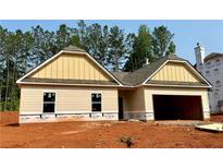 New construction home featuring a two-car garage and neutral siding at 486 Charleston Pl, Villa Rica, GA 30180