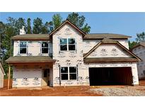 Two-story house with attached garage, windows, and siding awaiting completion at 488 Charleston Pl, Villa Rica, GA 30180