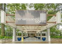 Welcoming entrance to Renaissance Lofts, showcasing modern architecture and lush landscaping at 120 Ralph Mcgill Ne Blvd # 1502, Atlanta, GA 30308