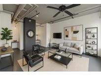 Bright living room featuring modern decor, neutral tones, track lighting, and a stylish ceiling fan at 120 Ralph Mcgill Ne Blvd # 1502, Atlanta, GA 30308
