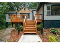 Lovely back deck with natural wood steps perfect for enjoying a relaxing afternoon outdoors at 243 Howell Ter, Atlanta, GA 30331