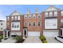 Charming brick townhome with attached garage and well-maintained landscaping at 3655 Chattahoochee Summit Se Dr # 16, Atlanta, GA 30339