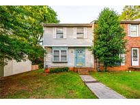 Charming exterior elevation of home with a tree lined yard and welcoming curb appeal at 1406 Springleaf Se Cir, Smyrna, GA 30080
