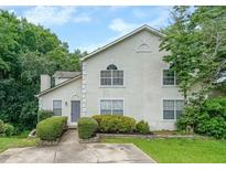 Charming stucco two-story home with well-manicured landscaping and inviting entrance at 4228 Lakes End Nw Dr, Kennesaw, GA 30144