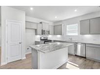 New kitchen featuring granite countertops, stainless steel appliances and light gray cabinetry at 189 Park Ln, Fairburn, GA 30213