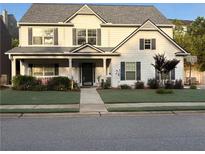 Charming two-story home featuring a covered front porch and a well-manicured lawn at 226 Creek View Ln, Acworth, GA 30102