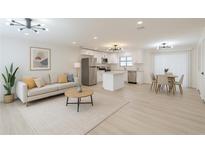 Bright open-concept living room with stainless steel appliances and modern decor for comfortable living at 4922 Glenside Ct, Stone Mountain, GA 30088
