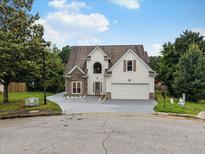 Charming two-story home with stone accents, attached two-car garage and well-maintained landscaping at 3042 Oak Vista Way, Lawrenceville, GA 30044