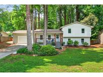 Charming split-level home featuring a well-maintained lawn and inviting front entrance at 5341 Tall Oak Dr, Marietta, GA 30068