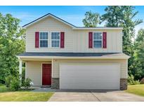 Charming two-story home featuring red shutters, a covered porch, and an attached two-car garage at 3 Windsor Ct, Kingston, GA 30145