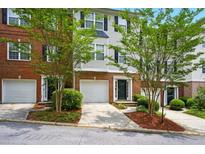 Charming townhouse with brick and siding exterior, front yard, and attached garage at 760 Celeste Sw Ln, Atlanta, GA 30331