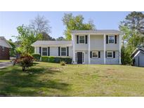 Charming two-story home featuring black shutters and a well-maintained front lawn at 2637 Elkhorn Dr, Decatur, GA 30034