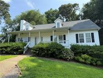Charming single Gathering home with a welcoming front porch and well-maintained landscaping at 296 Hayes Trce, Hiram, GA 30141