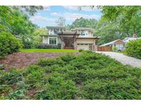 Stunning two-story home with lush greenery and a modern architectural design, blending nature with sophistication at 1267 Thomas Rd, Decatur, GA 30030