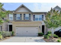 Inviting two-story home featuring a brick facade and a two-car garage at 5016 Garrett Ct, Alpharetta, GA 30005