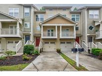 Inviting townhouse exteriors with private garages, balconies, and well-maintained landscaping at 1293 Liberty Nw Pkwy, Atlanta, GA 30318