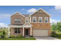 Charming two-story home with brick and stone accents, covered entry, and attached two-car garage at 92 Sheryl Way, Loganville, GA 30052