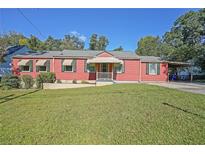 Charming single-story home with a well-maintained lawn and a cozy front porch at 2055 Anderson Se Dr, Smyrna, GA 30080