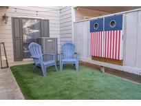 Inviting outdoor space featuring artificial turf, Adirondack chairs, and a custom cornhole game at 4846 Twin Lakes Trl, Atlanta, GA 30360