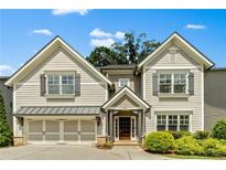 Charming two-story home with a welcoming entrance, complemented by lush landscaping and a two-car garage at 3821 Chamblee Dunwoody Rd, Atlanta, GA 30341
