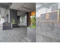 The Ritz-Carlton Residences entrance showcases elegant planters and dark stone architecture at 3630 Peachtree Ne Rd # 2309, Atlanta, GA 30326